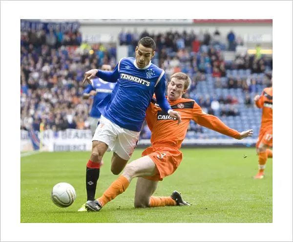 Mervan Celik vs Paul Dixon: A Riveting Clash at Ibrox Stadium - Rangers vs Dundee United in the Scottish Cup Fifth Round (Rangers 0-2 Dundee United)
