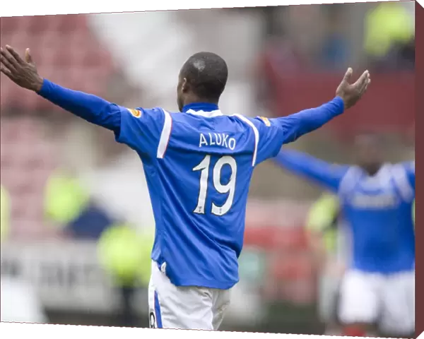 Rangers Sone Aluko Celebrates Glory: A 19-Year-Old's Exultant Moment as Rangers Crush Dunfermline 4-1 in the Scottish Premier League