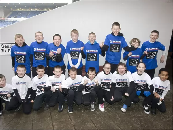 Young Rangers Soccer School Players Half-Time Takeover: A Glimpse of Future Stars Amidst Current Scottish Premier League Battle (0-1 in Favor of Kilmarnock)