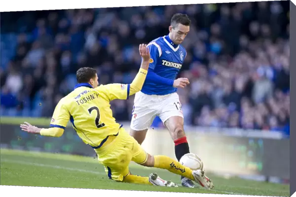 Dramatic Encounter at Ibrox: Lee Wallace vs. Lewis Toshney - Kilmarnock Takes the Lead (1-0)