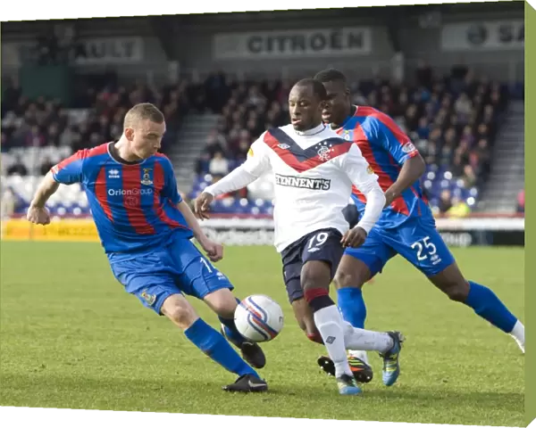 Rangers Sone Aluko Faces Off Against Inverness Defenders Nick Ross and Claude Gnakpa in Intense Clydesdale Bank Scottish Premier League Clash (1-4 in Favor of Rangers)