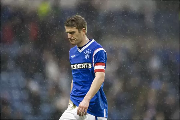 Steven Davis in Disappointment: Rangers Defeat to Heart of Midlothian (1-2) in the Scottish Premier League at Ibrox Stadium