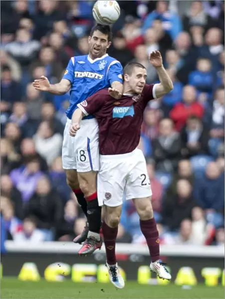 Bocanegra vs Glen: A Tight 1-2 Victory for Hearts in the Clydesdale Bank Scottish Premier League Clash at Ibrox Stadium