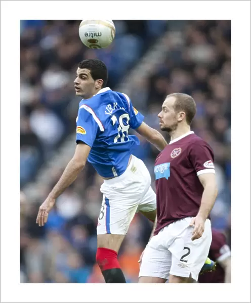 Rangers vs Hearts: Dramatic Clash between Salim Kerkar and Jamie Hammill at Ibrox Stadium in the Scottish Premier League (1-2 in Favor of Hearts)