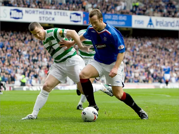 Rangers vs Celtic: Intense Clash Between Charlie Adam and Gary Caldwell in Rangers 3-0 Victory (Clydesdale Bank Premier League)