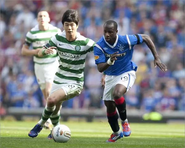 Dramatic Moment: Sone Aluko Scores the Winning Goal Past Ki Sung Yueng at Ibrox Stadium (Rangers 3-2 Celtic)