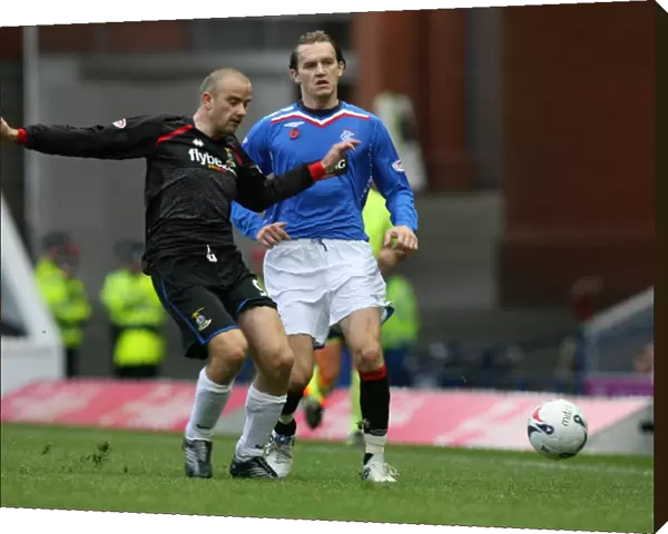 Intense Clash: Rangers Sasa Papac vs Inverness Caledonian Thistle's Graham Bayne in a 2-0 Clydesdale Bank Premier League Match at Ibrox