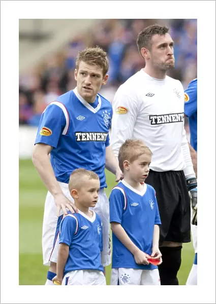 Rangers Steven Davis Celebrates Glory with Mascots after Securing Motherwell's 1-2 Defeat in Scottish Premier League