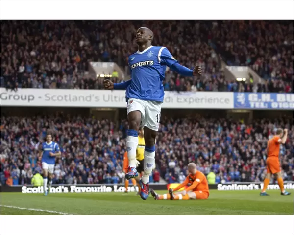 Rangers Sone Aluko Rejoices in His First Goal: 5-0 Victory Over Dundee United at Ibrox Stadium (Scottish Premier League)