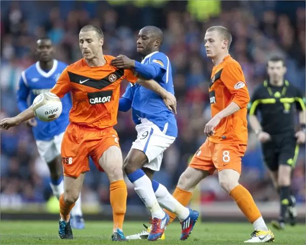 Rangers Sone Aluko vs. Paul Dixon: A Battle in Rangers 5-0 Victory over Dundee United at Ibrox Stadium (Scottish Premier League)