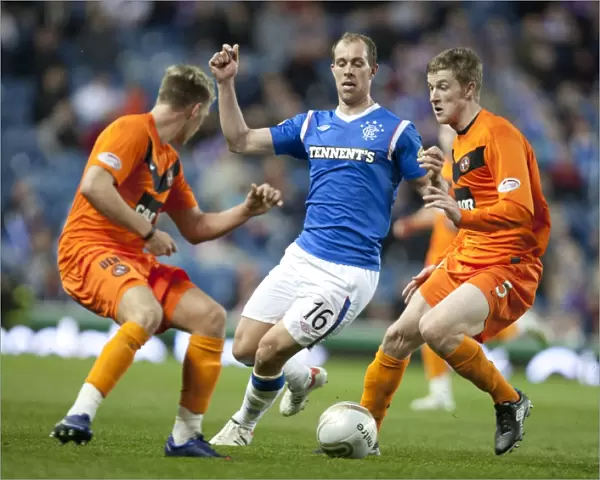 Rangers Unstoppable Triumph: Whittaker Stands Firm Against Douglas and Dixon's Challenge in 5-0 Clydesdale Bank Scottish Premier League Showdown at Ibrox Stadium