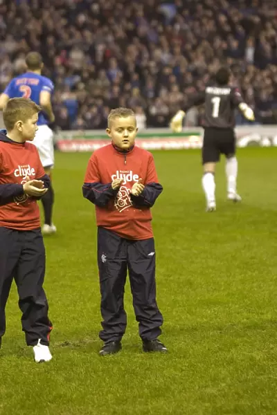 Rangers vs Hearts: A 2-1 Victory Battle in the Clydesdale Bank Premier League - Celebrating with Rangers and Cash for Kids Mascots at Ibrox