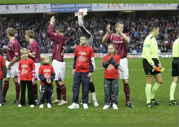 Thrilling Rangers Victory: 2-1 Over Hearts in the Clydesdale Bank Premier League at Ibrox - Joyful Cash for Kids Mascots