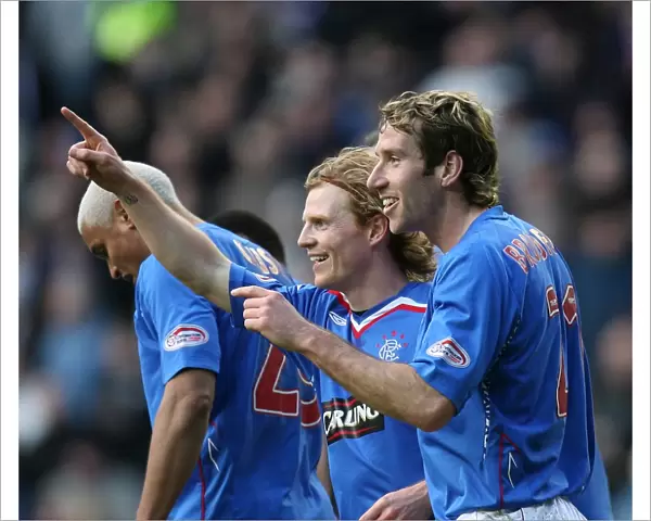 Rangers Chris Burke and Kirk Broadfoot: A Jubilant Moment as They Celebrate the Third Goal Against St. Mirren in the Clydesdale Bank Premier League at Ibrox (4-2)