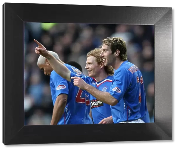 Rangers Chris Burke and Kirk Broadfoot: A Jubilant Moment as They Celebrate the Third Goal Against St. Mirren in the Clydesdale Bank Premier League at Ibrox (4-2)