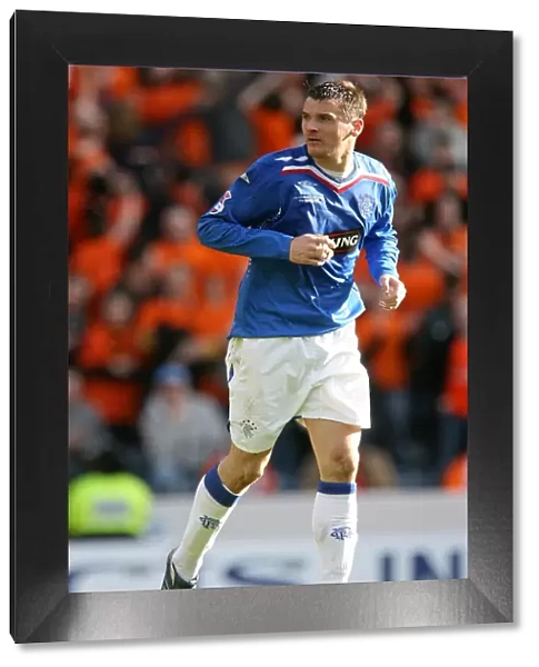 Lee McCulloch Lifts the CIS Insurance Cup: Rangers FC's Triumph over Dundee United (2008)