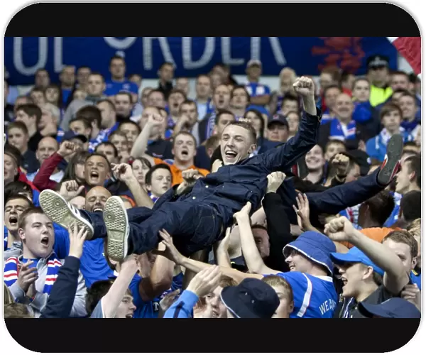Rangers Triumph: A Sea of Ecstatic Fans Celebrate 3-0 Victory over Falkirk at Ibrox Stadium
