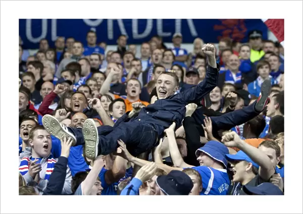 Rangers Triumph: A Sea of Ecstatic Fans Celebrate 3-0 Victory over Falkirk at Ibrox Stadium