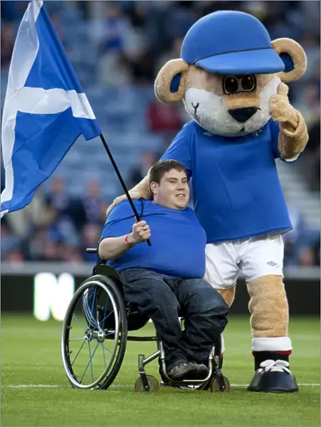 Rangers Flag Bearer Celebrates Glory: 3-0 Scottish League Cup Victory over Falkirk at Ibrox Stadium