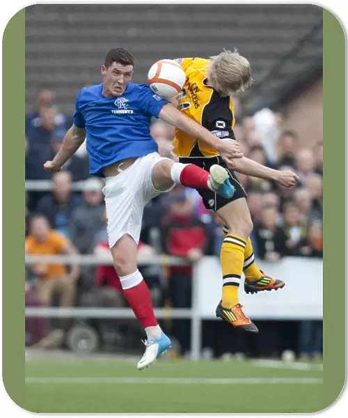 Rangers Ross Perry and Annan Athletic's David Murray: A Scoreless Battle in the Scottish Third Division at Galabank Stadium