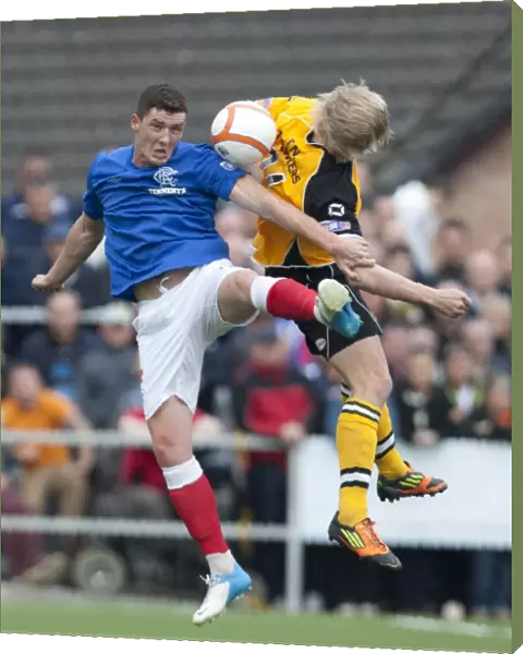 Rangers Ross Perry and Annan Athletic's David Murray: A Scoreless Battle in the Scottish Third Division at Galabank Stadium