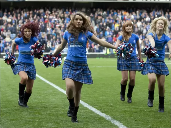 Rangers Lead 2-0 Against Queens Park: Cheerleaders in Action at Ibrox Stadium