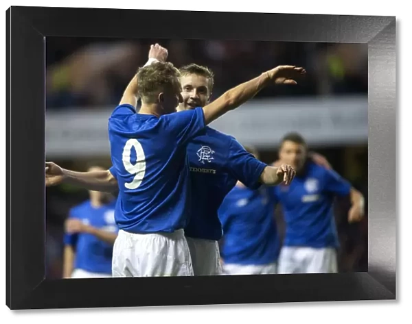 Rangers Robbie Crawford and Dean Shiels: Unstoppable Duo Celebrates Historic 7-0 Victory over Alloa at Ibrox