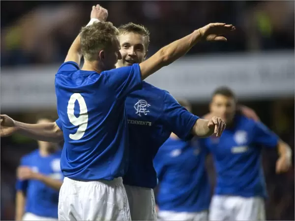 Rangers Robbie Crawford and Dean Shiels: Unstoppable Duo Celebrates Historic 7-0 Victory over Alloa at Ibrox