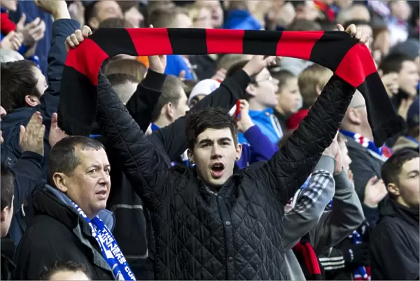 Exultant Rangers Fan Celebrates with Scarf at Ibrox Stadium: Rangers 2-0 Stirling Albion