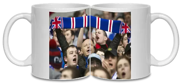 Triumphant Rangers Fan Celebrates 2-0 Victory over Stirling Albion at Ibrox with Scarf