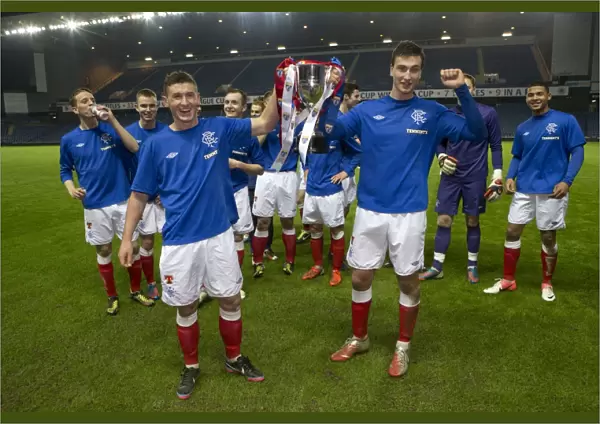 Rangers Reserves: Fraser Aird and Luca Gasparotto Celebrate SFL Reserve League Victory with the Trophy after 2-0 Win over Queens Park Reserves