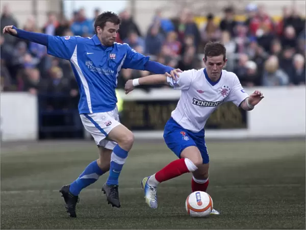 David Templeton and David Gray in Action: A Scoreless Battle in Montrose vs Rangers Third Division Clash at Links Park