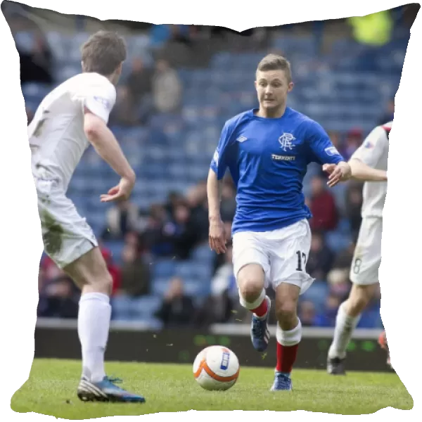 A Tight Battle: Peterhead's 1-2 Upset over Rangers in the Scottish Third Division at Ibrox Stadium - Dramatic Moment of Daniel Stoney
