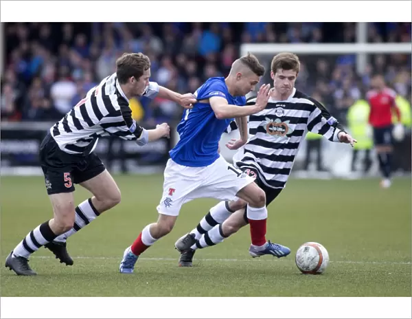 Rangers Daniel Stoney Battles Past Chris Moffat in Intense Scottish Third Division Clash at Ochilview Park (4-2)