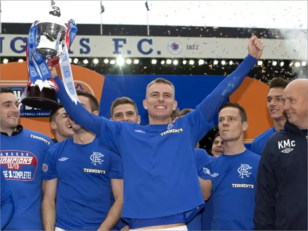 Rangers FC Celebrate Irn-Bru Scottish Third Division Title: Andy Mitchell Lifts the Trophy at Ibrox Stadium