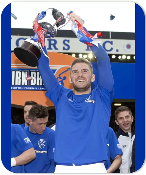 Rangers Football Club: Kyle Hutton's Triumphant Lift of the Irn Bru Third Division Trophy at Ibrox Stadium