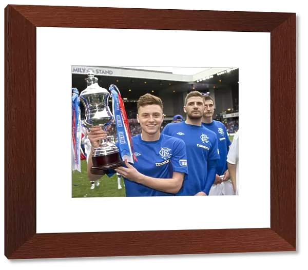 Rangers Football Club: Lewis Macleod Celebrates Third Division Title Win with the Irn Bru Trophy at Ibrox Stadium