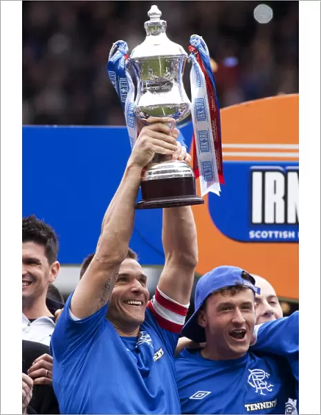 Rangers Football Club: Lee McCulloch's Triumphant Lift of the Irn Bru Third Division Trophy at Ibrox Stadium