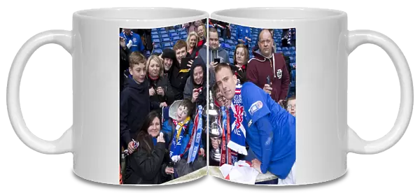 Rangers FC's Glory: Andy Mitchell Lifts the Irn-Bru Scottish Third Division Trophy at Ibrox Stadium (1-0 vs Berwick Rangers)