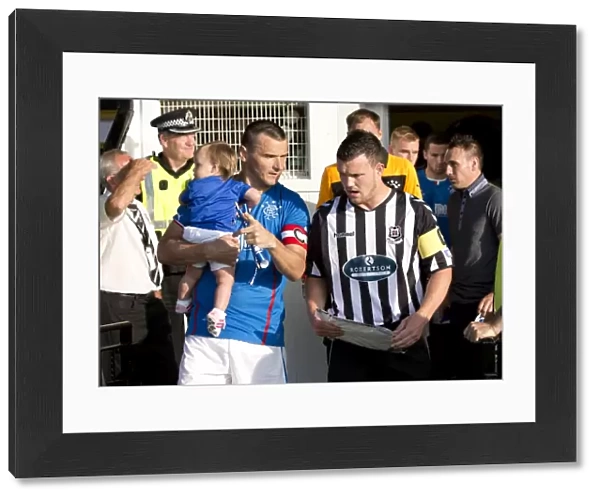 Rangers Lee McCulloch and Elgin City's David Niven: Leading Their Teams in Pre-Season Friendly (1-0 in Favor of Rangers)