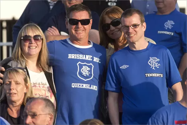Rangers Fans Bask in Sunshine: Celebrating a 1-0 Victory at Elgin City