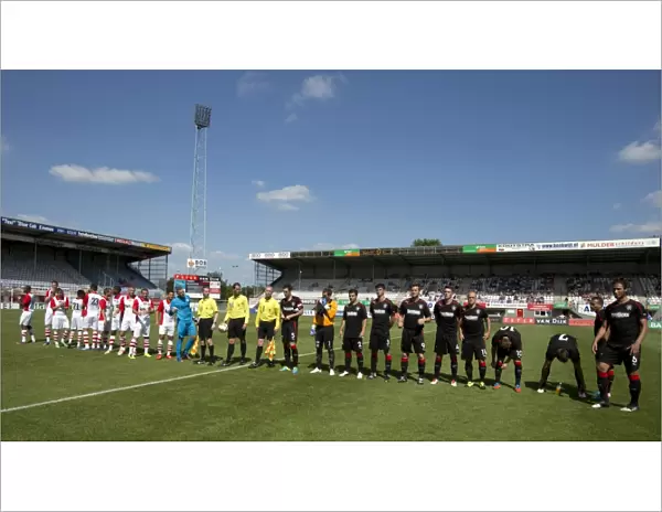 Rangers and FC Emmen Players Align Before Kick-Off at Meerdjik Stadium: Rangers Lead 1-0 in Pre-Season Friendly