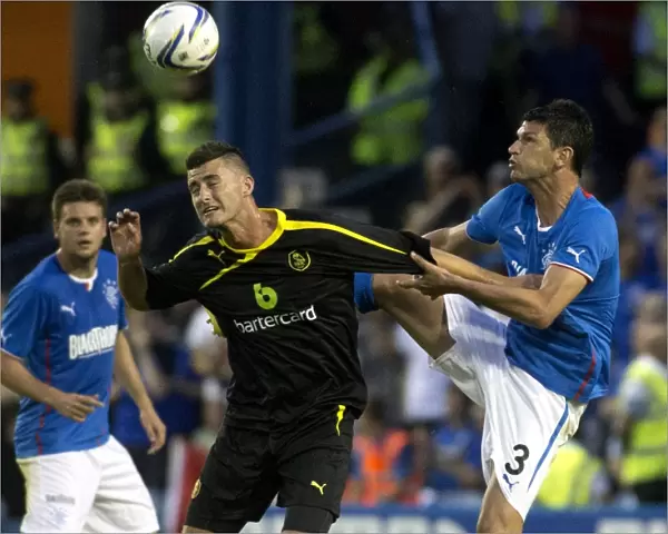 Emilson Cribari's Determined Battle for Possession: Sheffield Wednesday Leads 1-0 against Rangers
