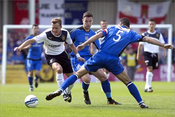 Rangers Dean Shiels Outmaneuvers Frank McKeown: 3-0 Domination Over Stranraer in Scottish League One