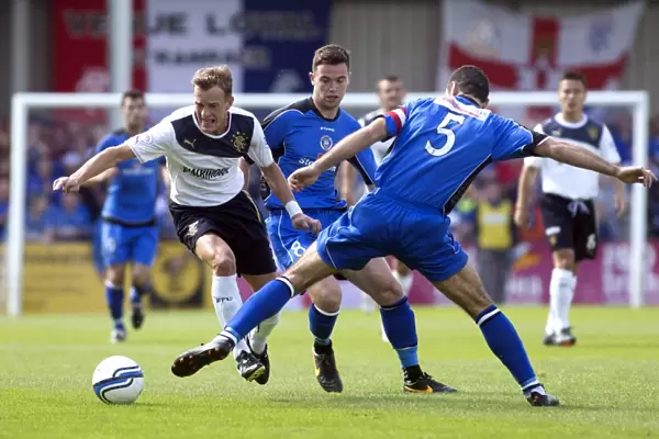 Rangers Dean Shiels Outmaneuvers Frank McKeown: 3-0 Domination Over Stranraer in Scottish League One