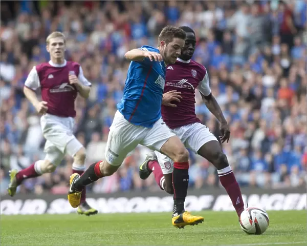 Rangers Andy Little Outmuscles Arbroath's David Banjo in Dominant 5-1 SPFL League 1 Performance at Ibrox Stadium