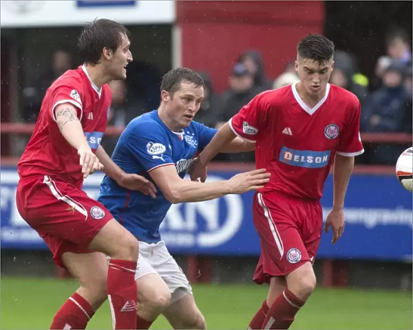 Intense Rivalry: Jon Daly's Battle for the Ball in Rangers Dramatic 3-4 SPFL League 1 Victory over Brechin City