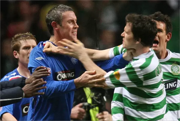 A Bittersweet End: David Weir and Gary Caldwell at the Final Whistle - Celtic's 2-1 Victory over Rangers