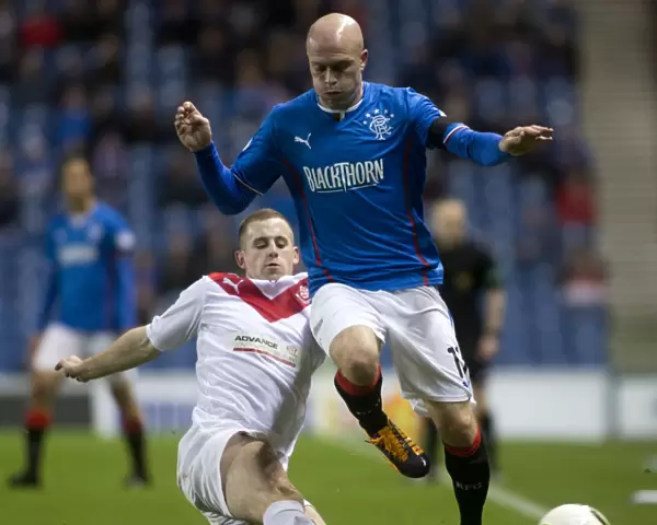 Rangers Triumph: Nicky Law Scores Brace as Rangers Defeat Airdrieonians 3-0 in Scottish Cup at Ibrox Stadium