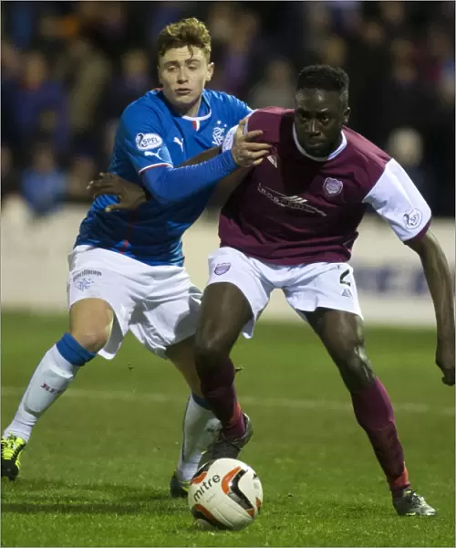 Rangers Macleod Fends Off Arbroath's Banjo in Scottish League One Clash at Gayfield Park